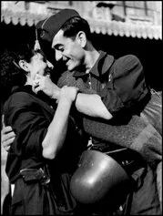 Robert Capa, Bidding farewell before getting on a military train directed to the Aragon front Spain, Catalonia. Spanish Civil War (1936-9), ICP 123. Barcelona. August, 1936, Robert Capa © International Center of Photography / Magnum Photos